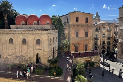 A group of old buildings along a street