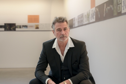 Richard Weller seated in gallery