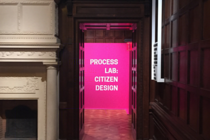 Baroque room with doorway leading to pink neon room with sign saying "Process Lab: Citizen Design"