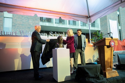 A bronze bust of Stuart Weitzman is unveiled by Dean Fritz Steiner (left) and President Amy Gutmann, while Weitzman (right) looks on during the Stuart Weitzman School of Design naming celebration. 
