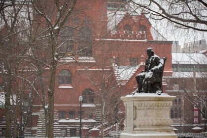 Snow covered statue of Ben Franklin on Penn Campus