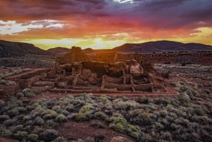 Adobe structure in partial ruin in the desert at dusk