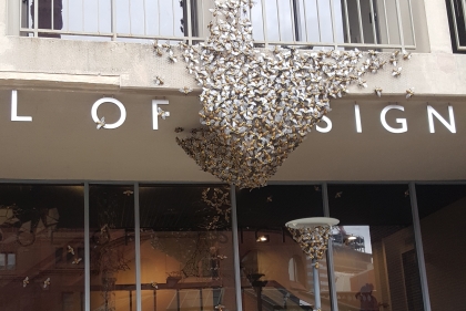 Front of school of design covered in model bees