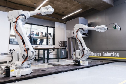 Massive white robotic arms in the Weitzman robotics lab