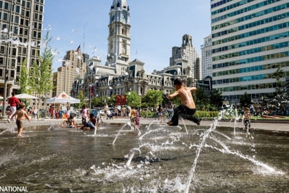 City hall with children playing in fountains in front