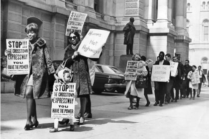 B/W photo of protestors outside of city hall protesting expressway