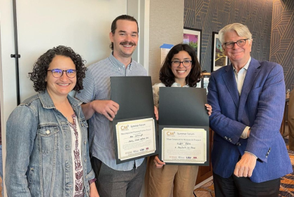 Alex Cartwright and Riddhi Batra display their awards with Dean Steiner and Rebecca Popowsky