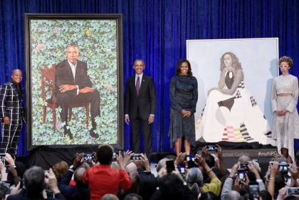 Photo by Olivier Douliery for The Inquirer of the former first lady Michelle Obama and former President Barack Obama pose with artists Kehinde Wiley and Amy Sherald during the unveiling of their official portraits at the National Portrait Gallery