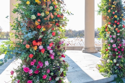 The colors of spring shown through beautiful flowers covering the columns of FDR Park Boathouse Gazebo.