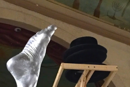 Sculpture featuring foot and hat