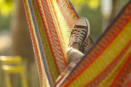 Hammock with person in it but only their foot is visible.