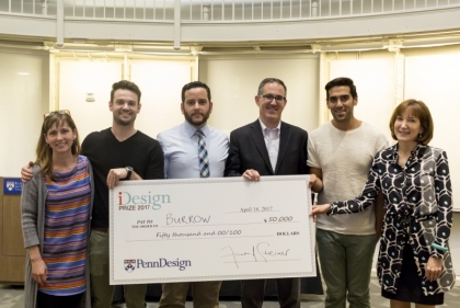 Group photo holding giant novelty check