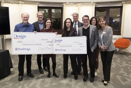 Group participants holding up prize check