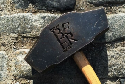 Sledgehammer with "Philly Beer Week" carved in the side.
