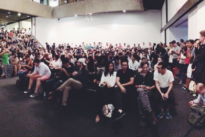 Large group listening to a lecture