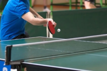 Man hitting a pingpong ball