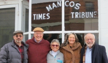 Group shout outside Mancos building.