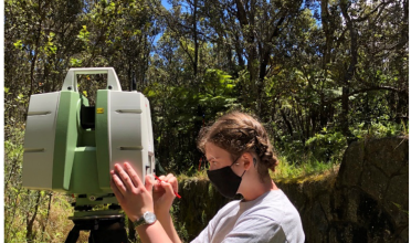 Tali Flatte operating a total station at Hawai'i Volcanoes National Park.