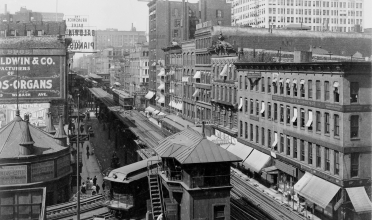 black and white photo of elevated train tracks