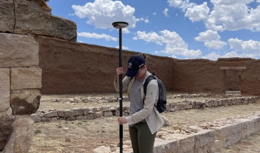 Cameron collecting a GPS coordinate to geo-reference the HABS planof Fort Union