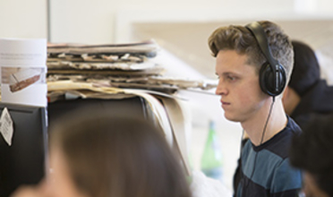 Student watching an online presentation