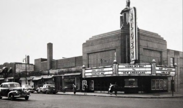 Black and white photo of a street corner in midcentury Detroit