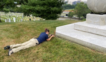 Alli Davis performs photographic survey documentation at Arlington National Cemetery.