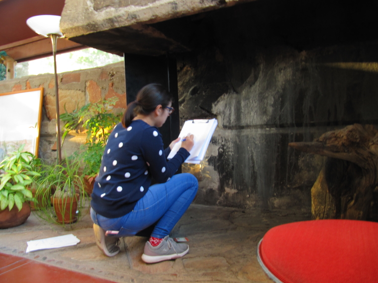 Mónica Ortiz Cortés recording data for the 3d model of the office. 