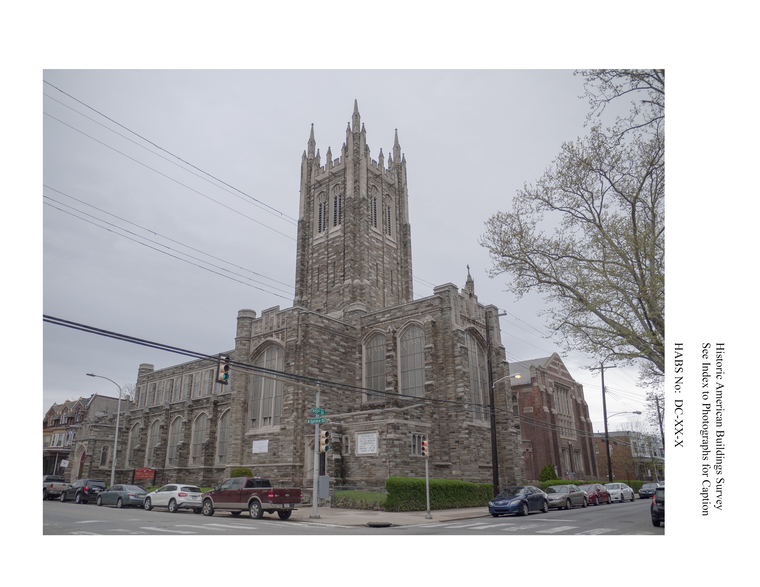 Photo documenting the facade of a large stone church