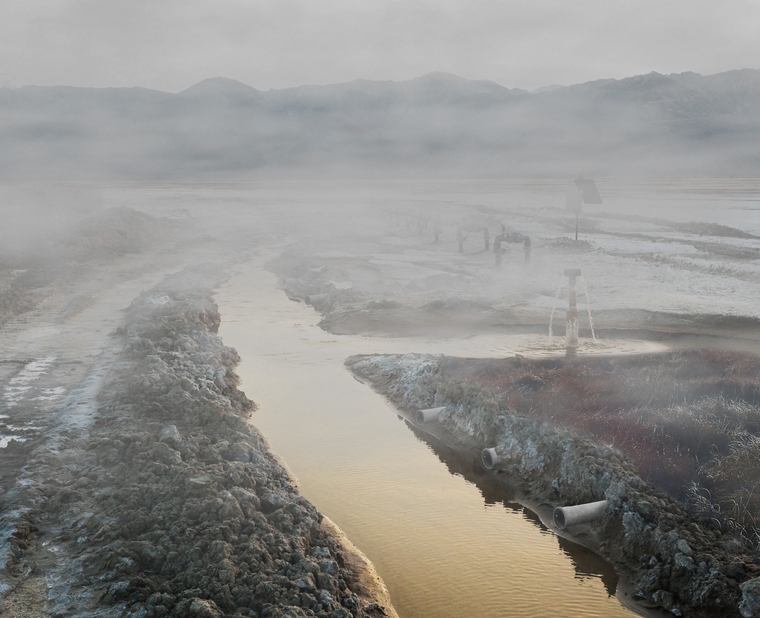 Steamy field with shallow flooding