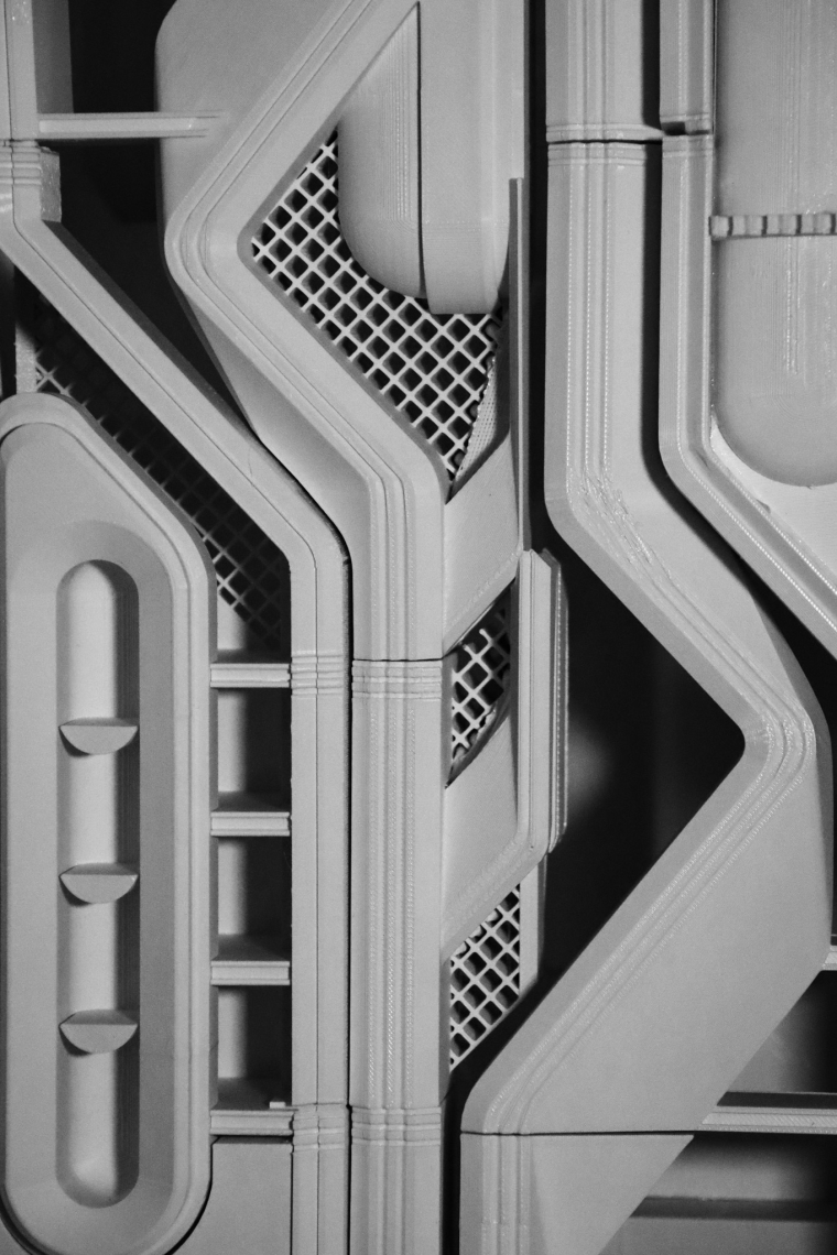 A close up black and white image of an architectural model