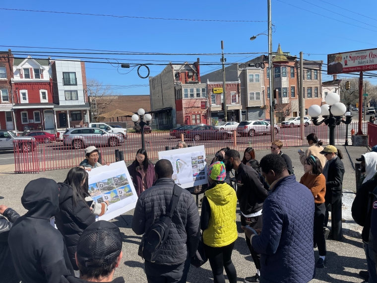 Photograph from a community meeting where students presented design ideas and worked with community members to determine priorities.