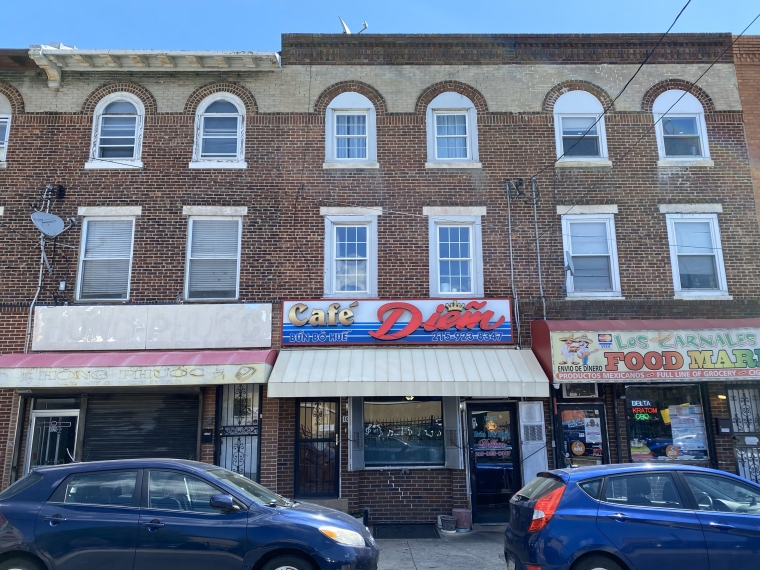 View of Café Diem on 8th Street, between Washington Avenue and League Street. An example of a Philadelphia rowhouse adapted for Vietnamese commercial use. Photo by Calvin Nguyen, 2023.