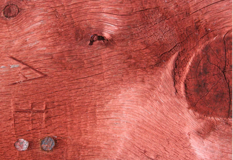 Wood staining from red ochre and cod liver oil paint.