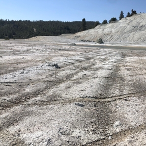 Barren landscape with tire tracks