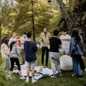 A group of people meet outside at Penn