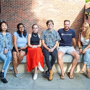 A group of students sitting outside of Meyerson Hall