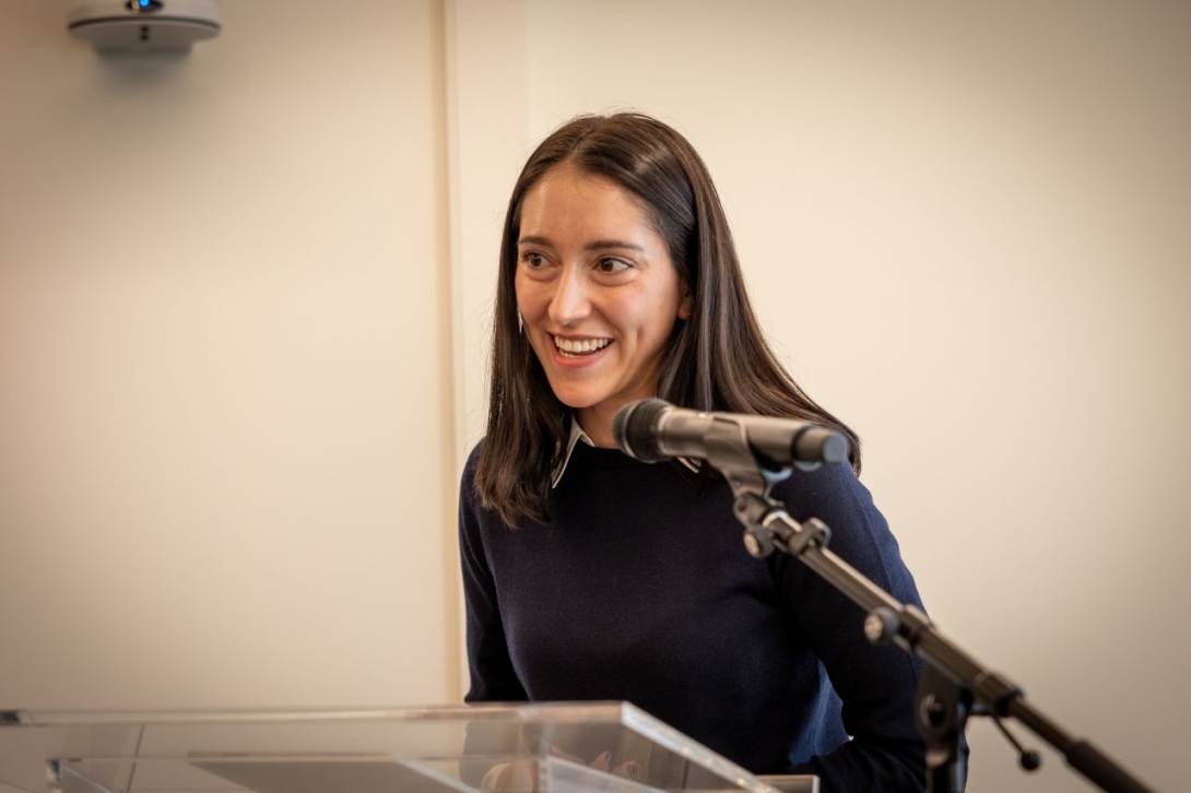 Laura Frances speaking at the podium