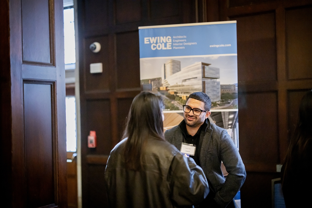 Jorge Couso speaking with a student