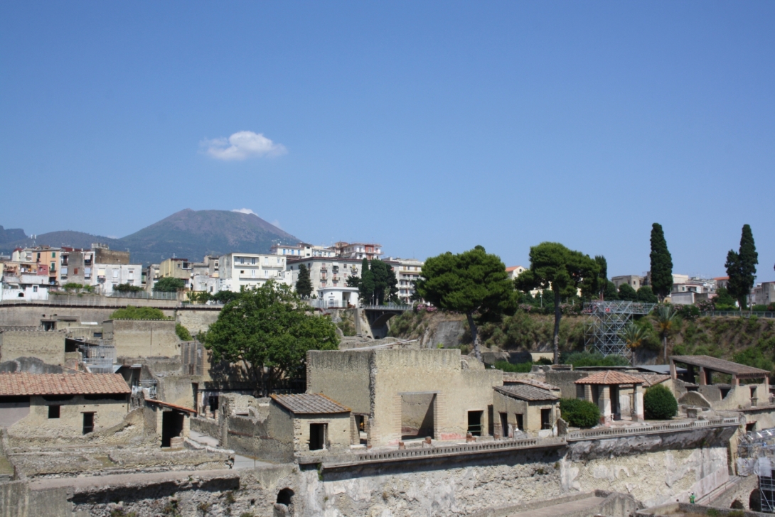 Italian urban landscape with mountain in background and archaeological site in foreground