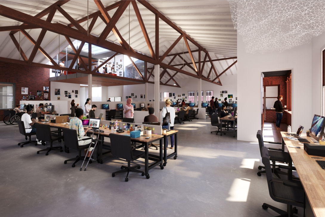 View of exposed wood beams with students seated at desks in studio