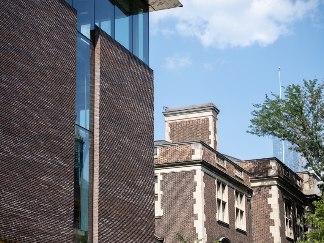 Red brick facade next to red and white brick facade
