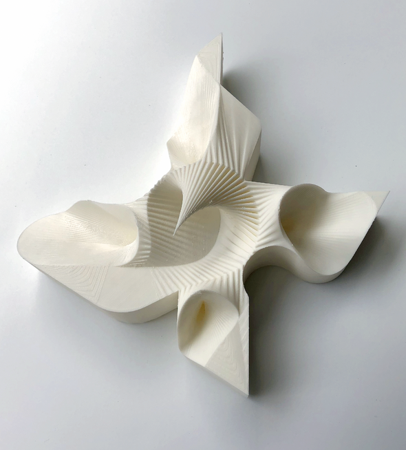 Photograph of physical model in curvy striated form in white high density foam
