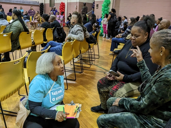 Betsy Ivey conducting the postcard writing activity at the Black History Month Extravaganza at F.J. Myers Recreation Center in February 2023. Photo Credit: Ashley Hahn.