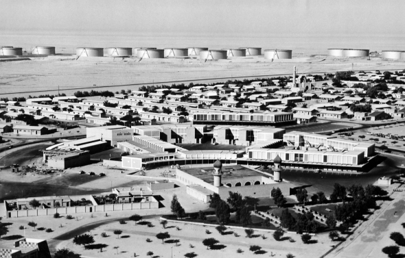 Aerial view of the Ahmadi Shopping Centre from behind, overlooking the tank farm on the outskirts of Arab Village.