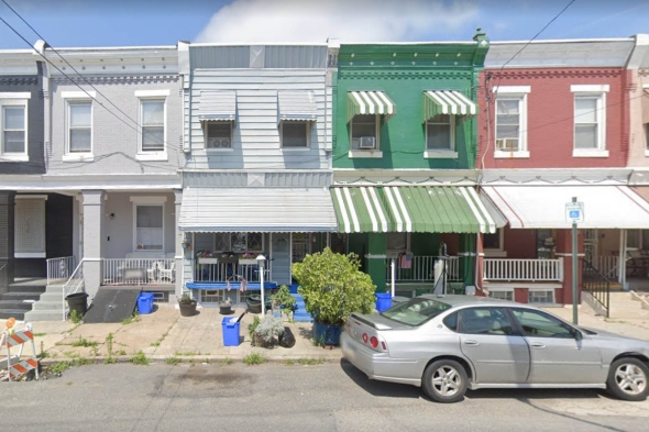 Rowhouses with recessed porches on North 31st St in Strawberry Mansion.