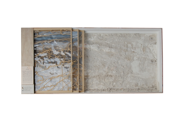 Physical topographic model of the Hackensack River with sand in a wood box and overlaid by laser cut layers of the roads and waterway boundaries.