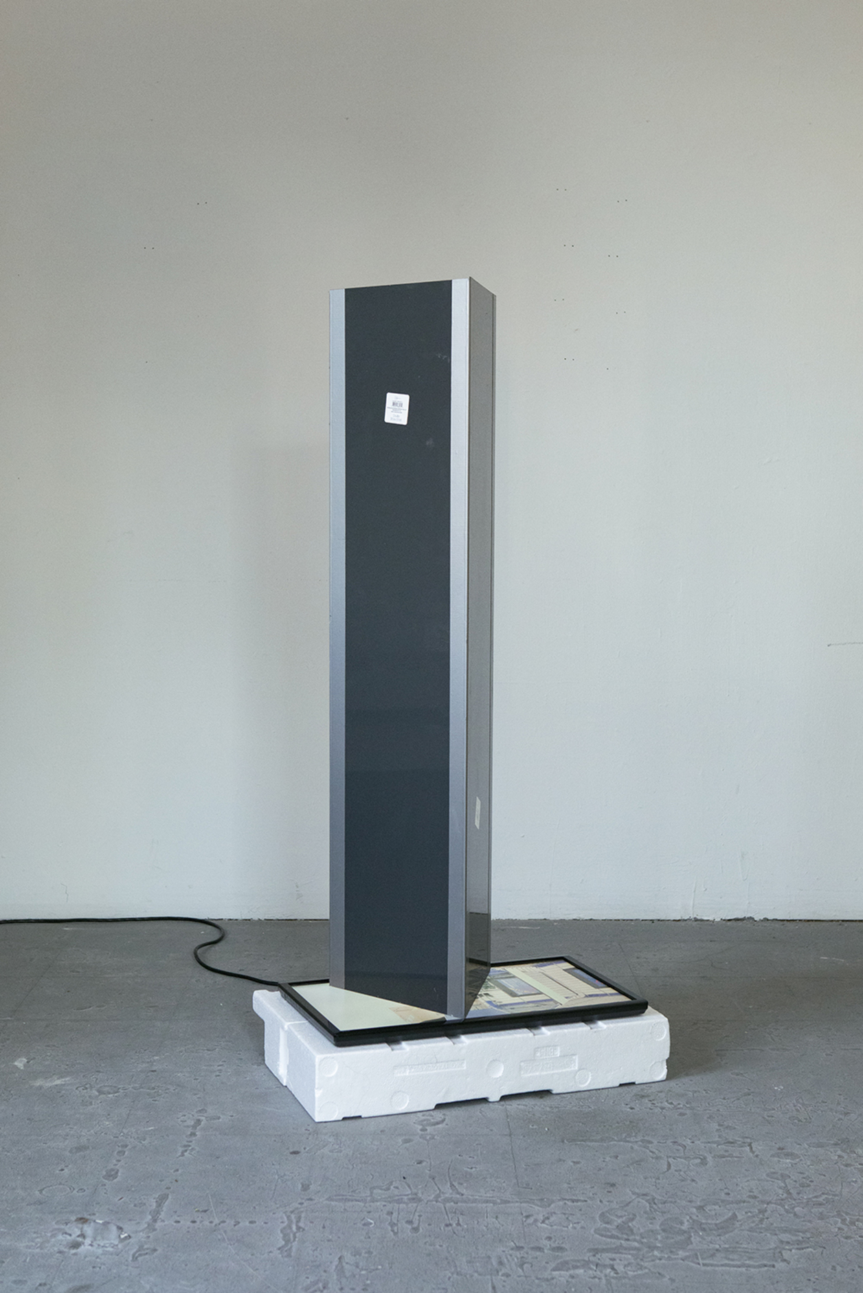 Tall thin sculpture with monitor built in