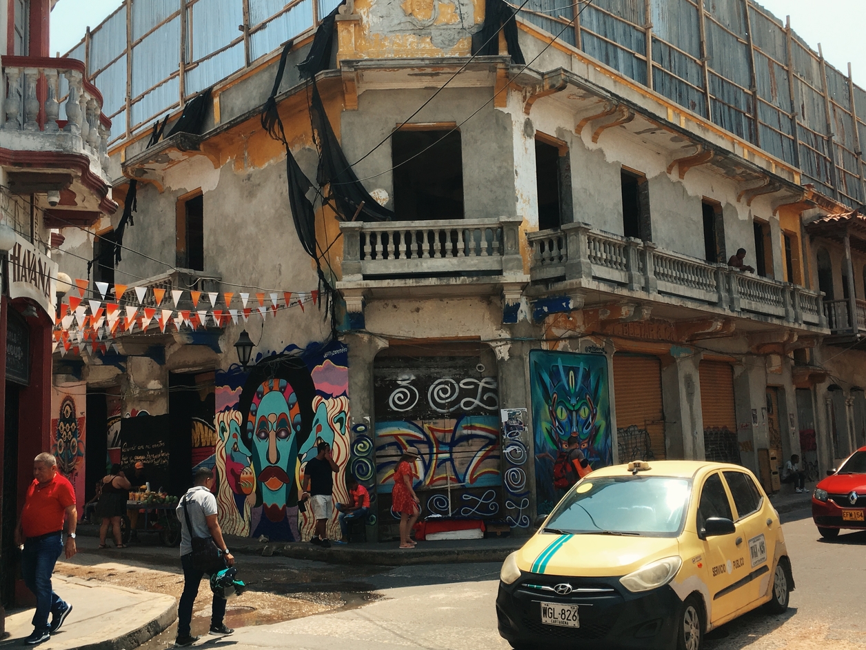 Street scene with old buildings covered in graffiti