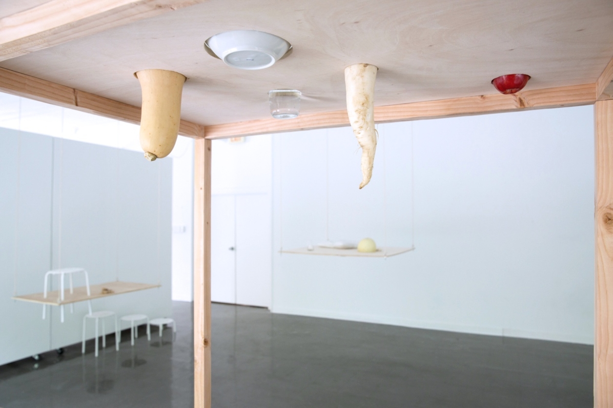 Artist installation with hanging wood elements 